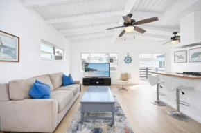 2 Bedroom Upstairs with Balcony Steps from the Sand